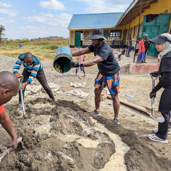 Workers building school